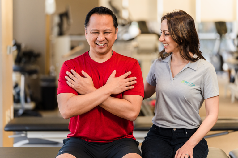 A therapist assisting a patient with rehabilitation exercises.